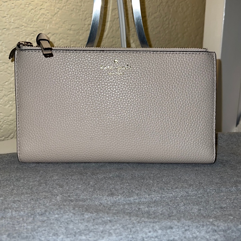SOLD!!Like new cream leather double sided Kate Spade wallet.